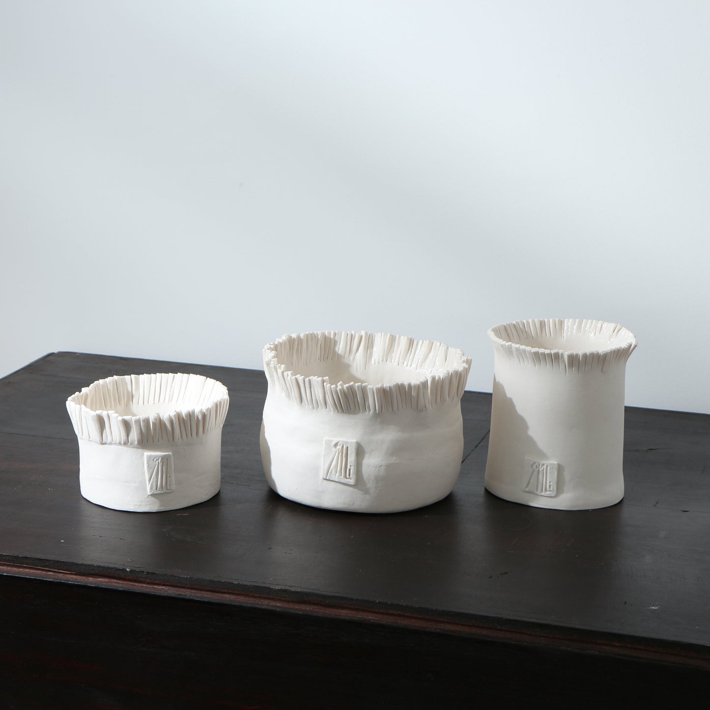 Pot frangé en porcelaine