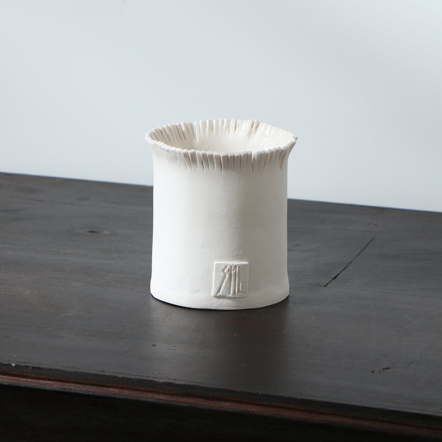 Pot frangé en porcelaine