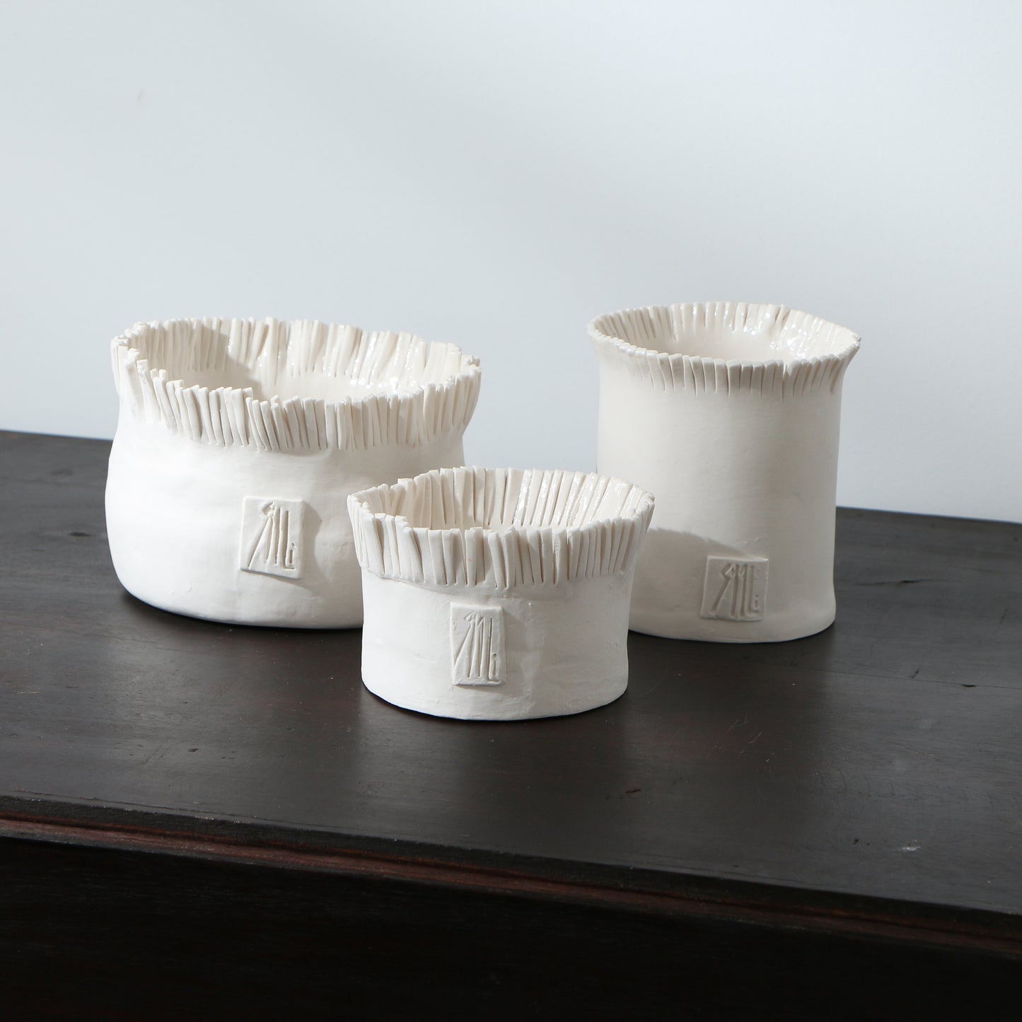 Pot frangé en porcelaine