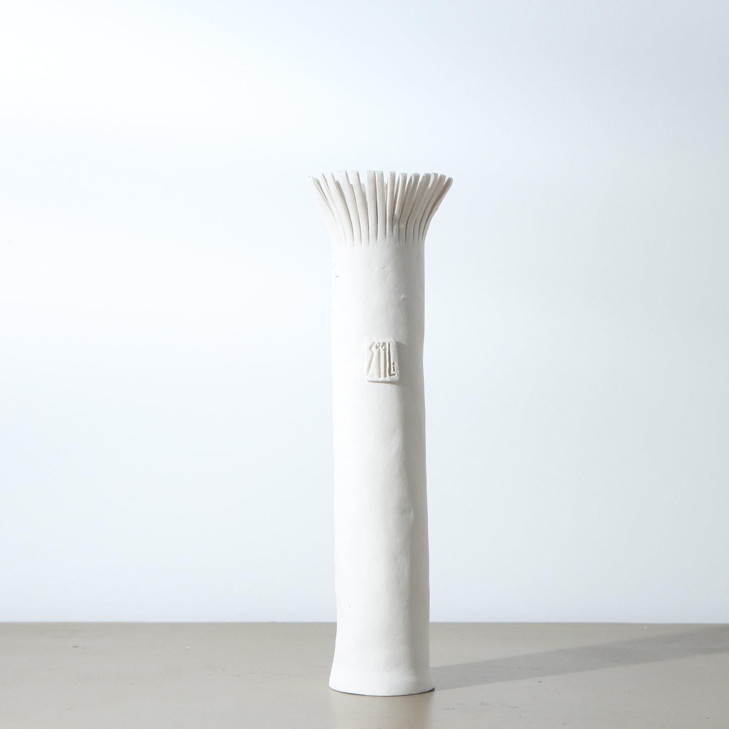 Soliflore en porcelaine frangé