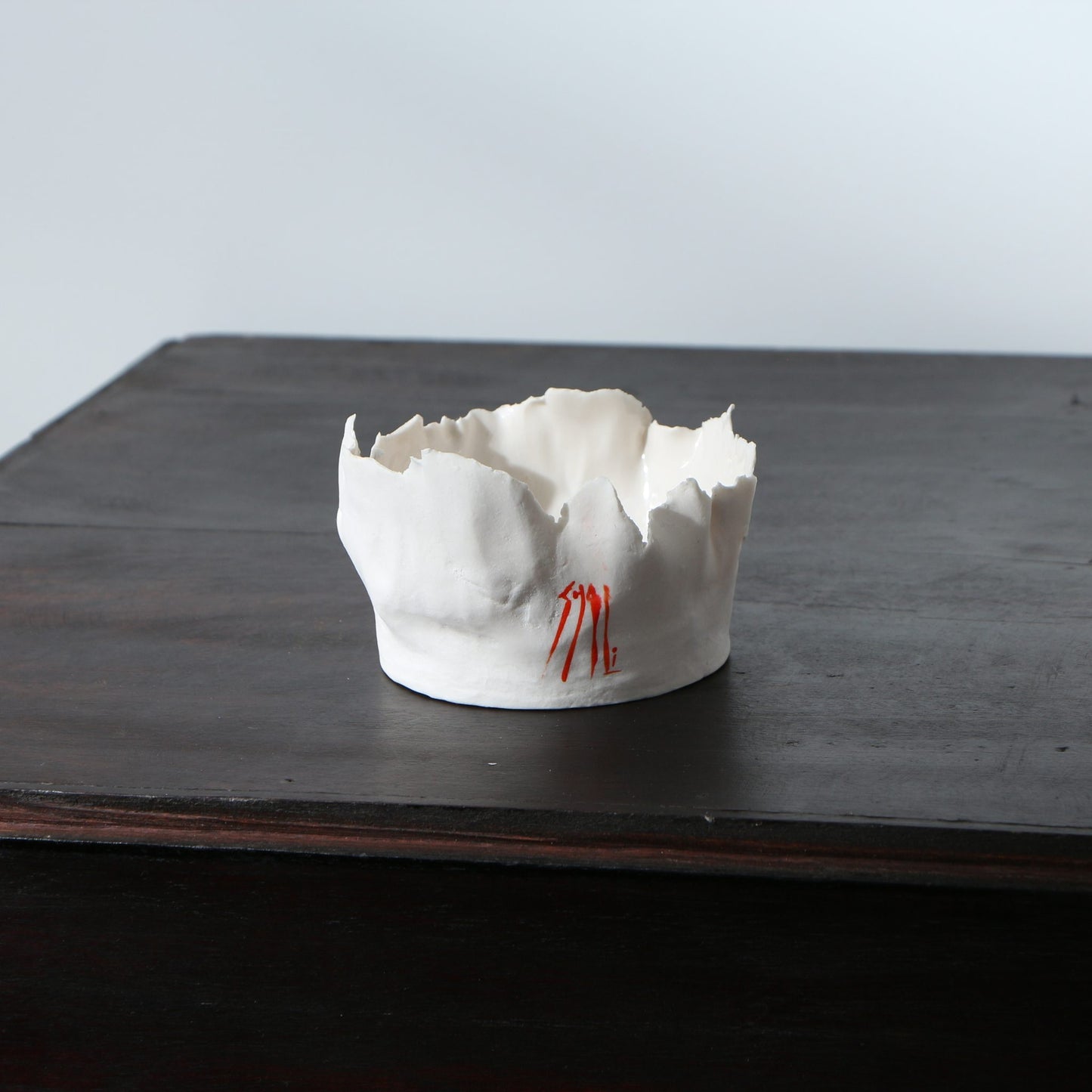 Petit pot porcelaine déchirée signature orange